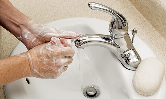 washing-hands-at-bathroom-sink