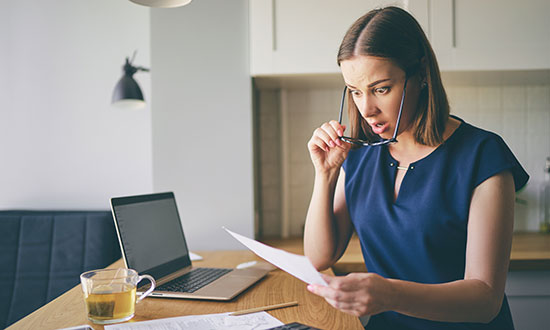 water-bIll-jump-woman-looking-with-surprise-at-paper-bIll