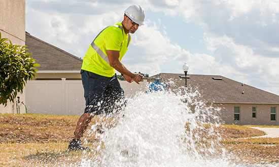 watermain-flushing-utility-worker-fire-hydrant