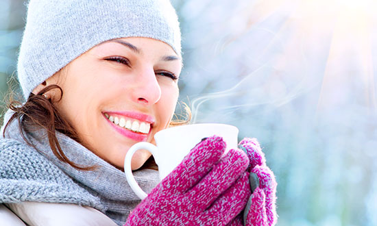 winter-outdoor-woman-holding-steaming-mug