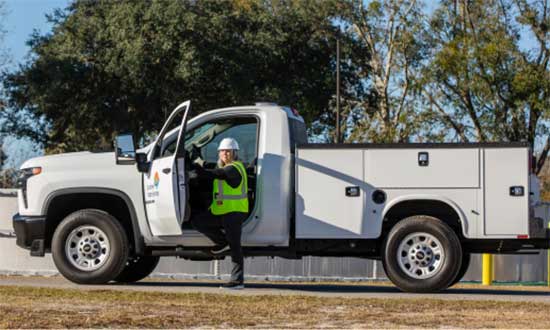 utility-worker-stepping-out-of-service-truck