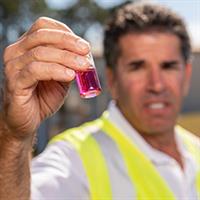 Careers Male Utility Field Employee Taking Water Sample