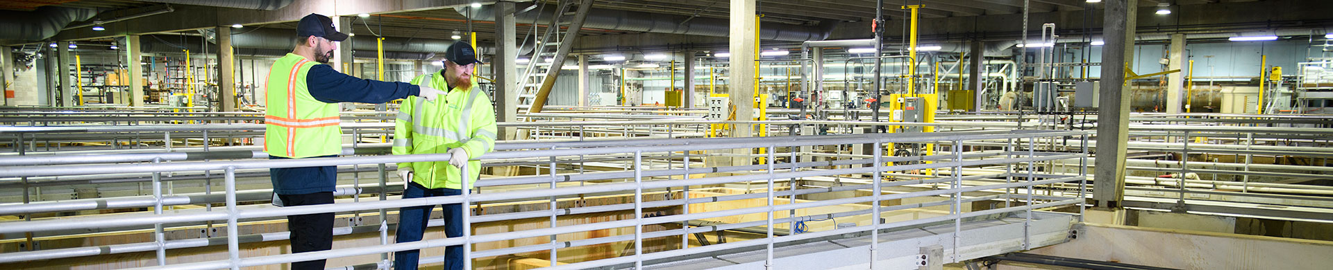 HD1920x390-Utility-Workers-Inspecting-Inside-Wastewater-Treatment-Tanks