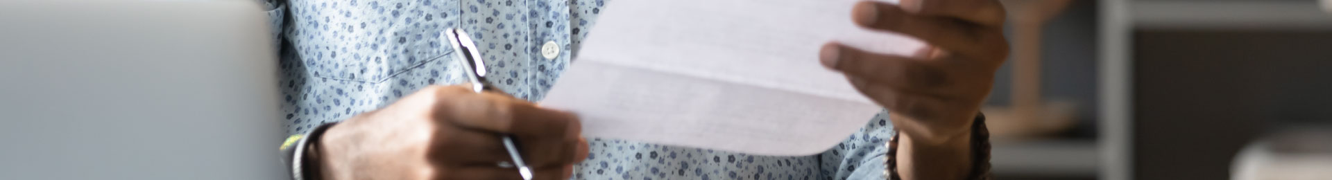 ID1920x260 My Bill Man Looking at Paper Bill