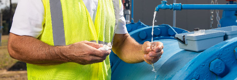 IM768x260 Utilty Worker Taking Water Quality Sample