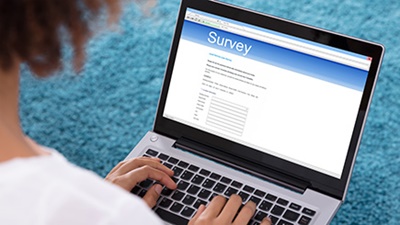 LSL-Survey-Woman-Completing-Online-Survey