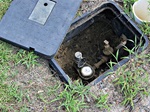 water-meter-cover-open-outdoors water-meter-cover-open-outdoors